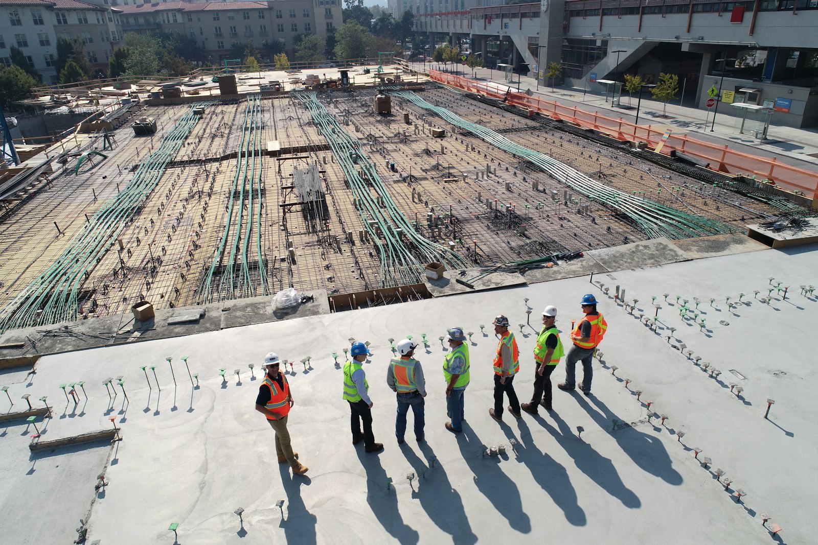 Commercial construction site with rebar and slab prep before a structural concrete pour